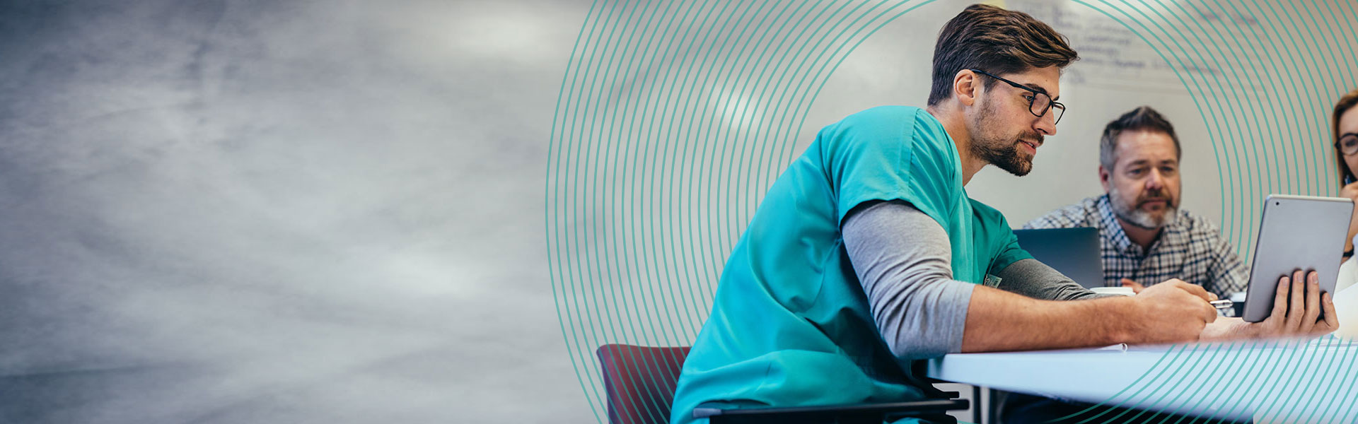 Medical staff having morning meeting in boardroom