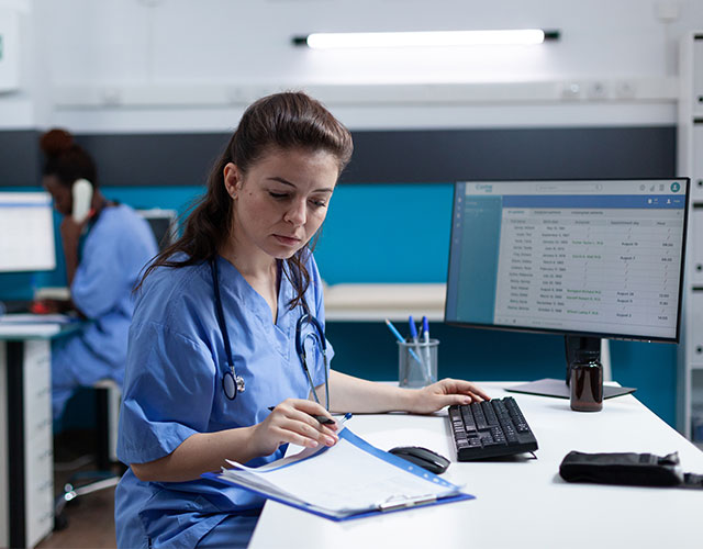 Pharmacist nurse with stethoscope analyzing healthcare treatment on medical documents.