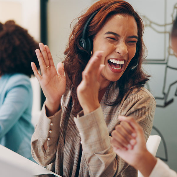 Group of people, business and celebration in call center, office and company for success or achievement.