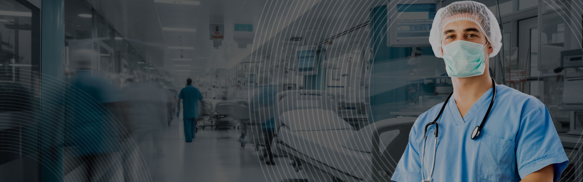 A busy ward and a doctor facing the camera