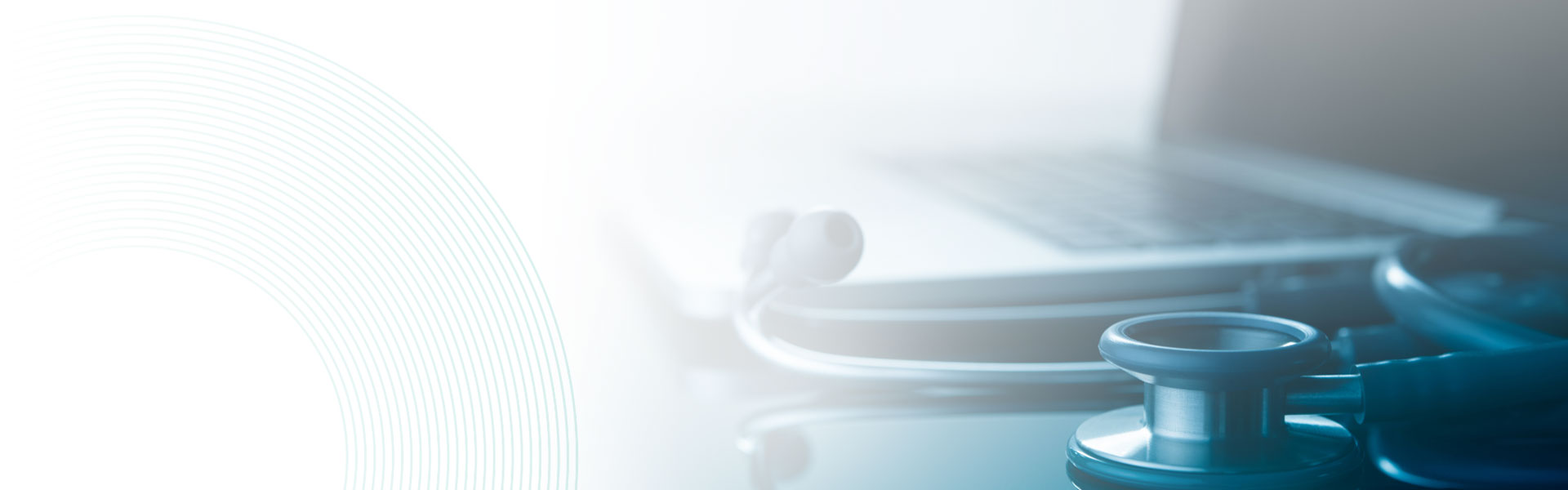 doctor stethoscope on a desk with a laptop