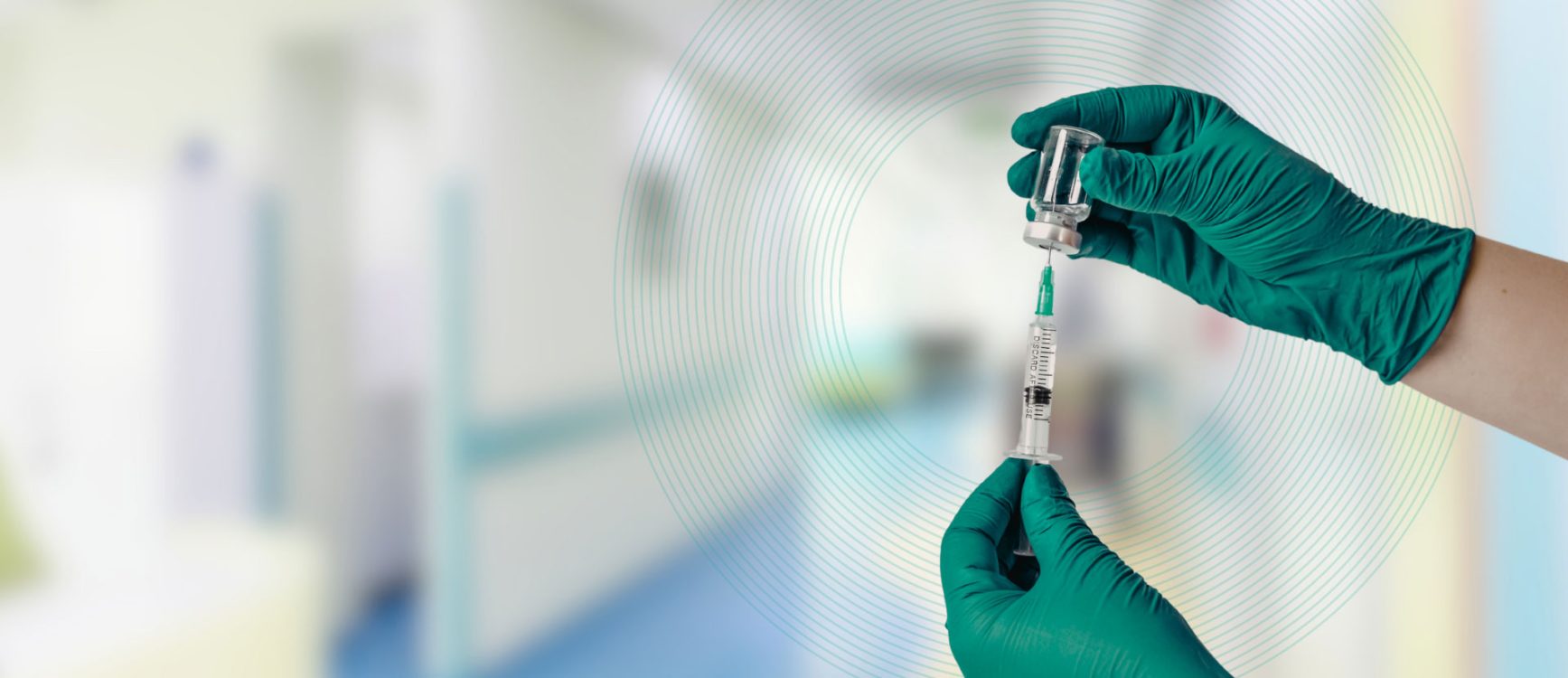 a doctor filling up a medicine from a bottle