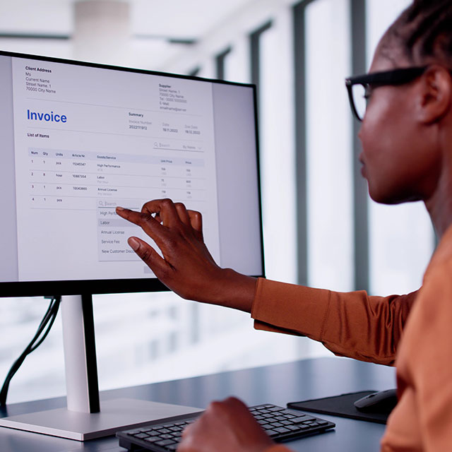 An employee using a receipting service on a computer
