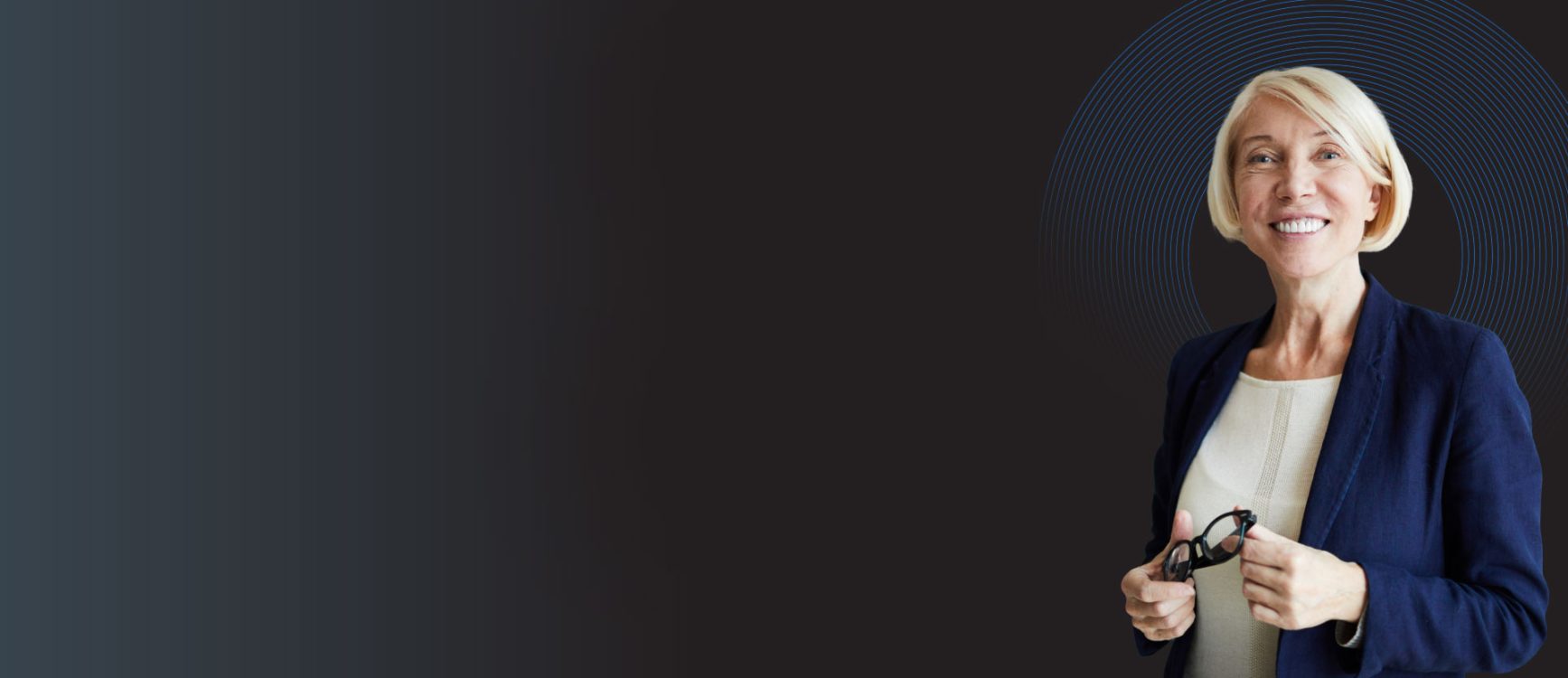 a woman hr professional specialising in NHS HR holding her glasses