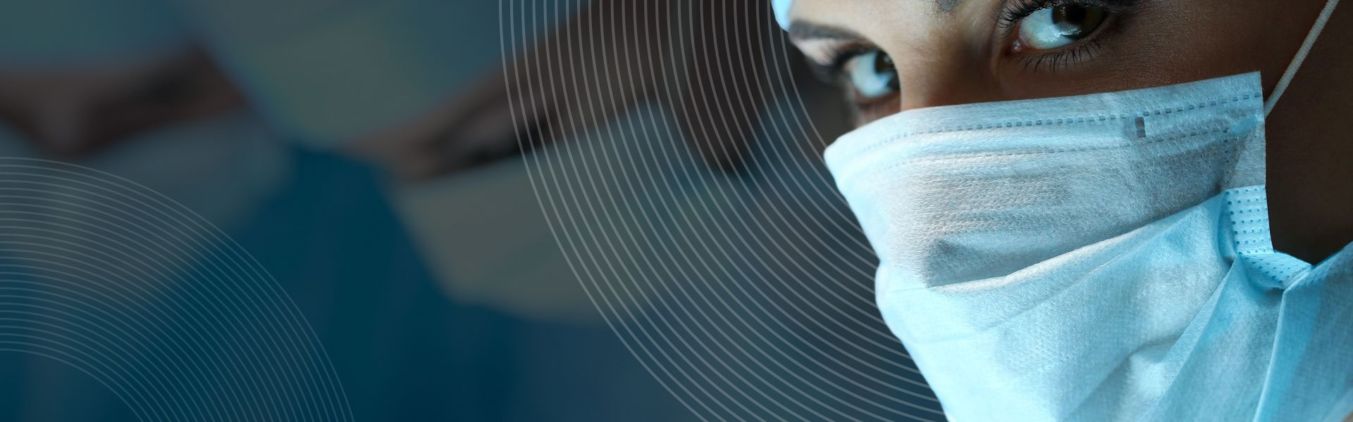 a close up of an NHS surgeons face in theatre