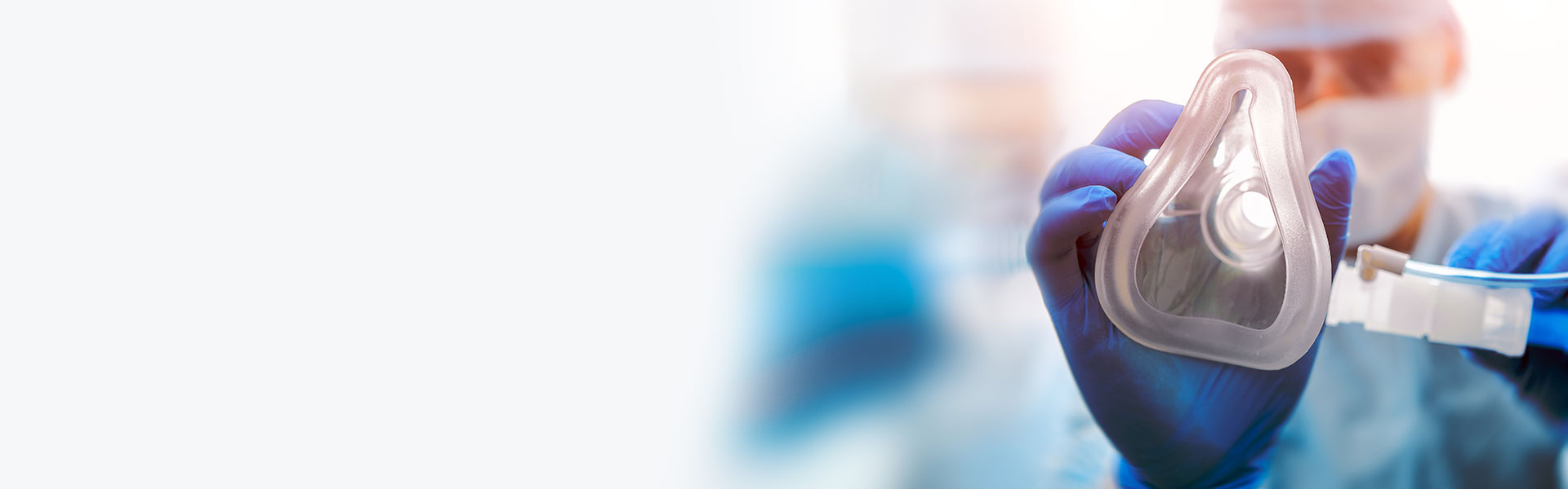 Doctor puts on oxygen mask point of view