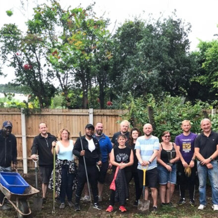 NHS SBS and Birmingham’s Active Wellbeing Society get the gloves on to glam up community wellbeing garden